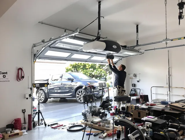 Columbus Garage Door Repair specialist installing smart garage door opener system in Columbus home