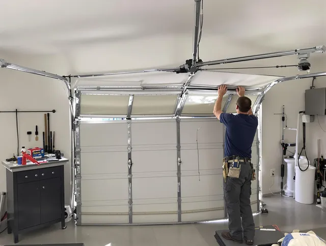 Columbus Garage Door Repair specialist performing precise section replacement on Columbus garage door